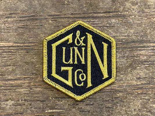 Gunn & Co Gold And Black Embroidered Cloth Badge. Badge