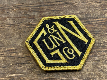 Gunn & Co Gold And Black Embroidered Cloth Badge. Badge