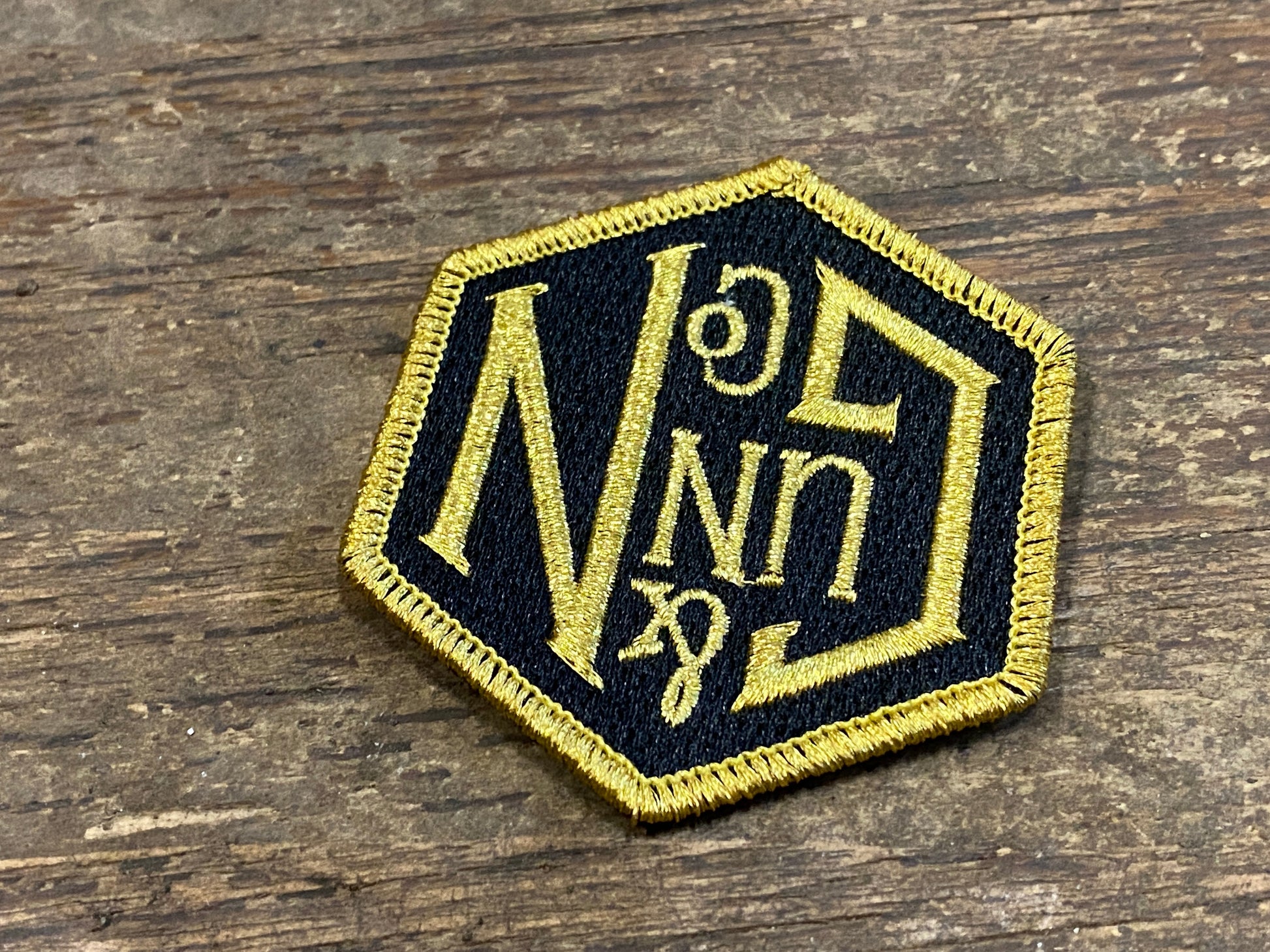 Gunn & Co Gold And Black Embroidered Cloth Badge. Badge