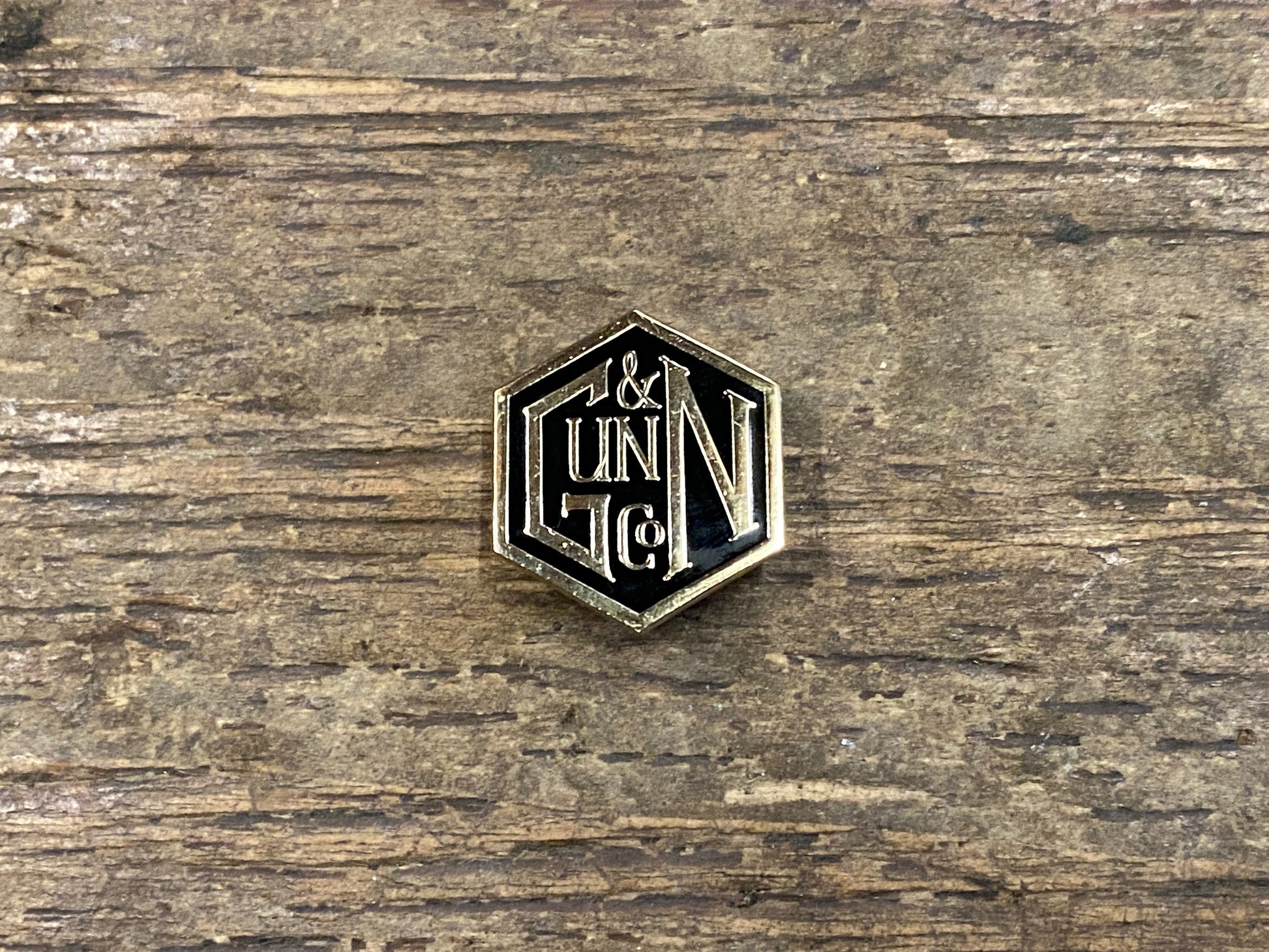 Gunn & Co Gold And Black Enamel Lapel Pin Badge. Badge