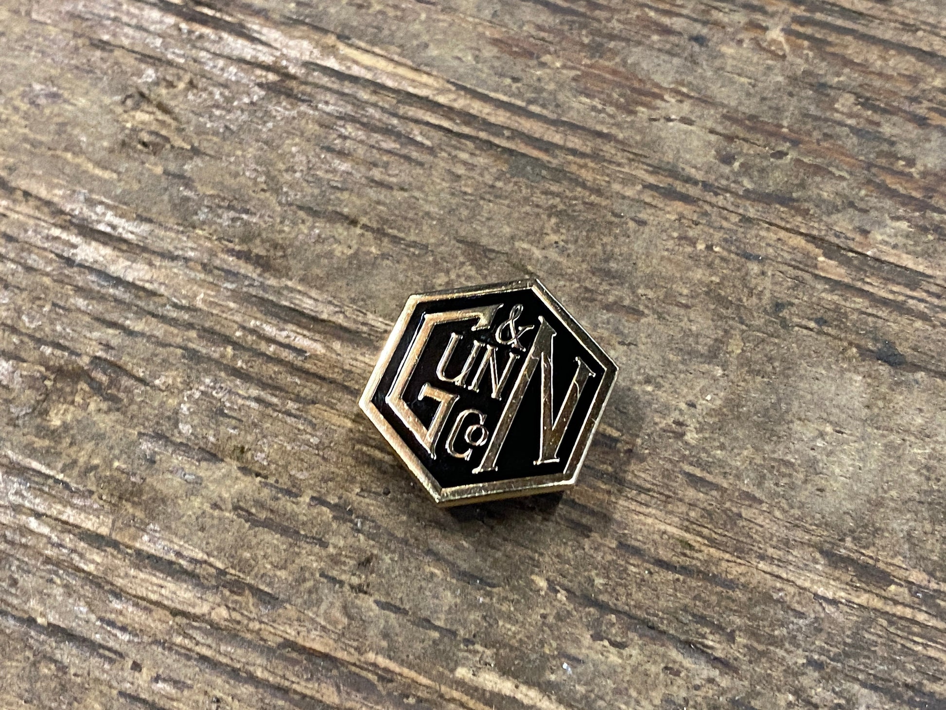 Gunn & Co Gold And Black Enamel Lapel Pin Badge. Badge