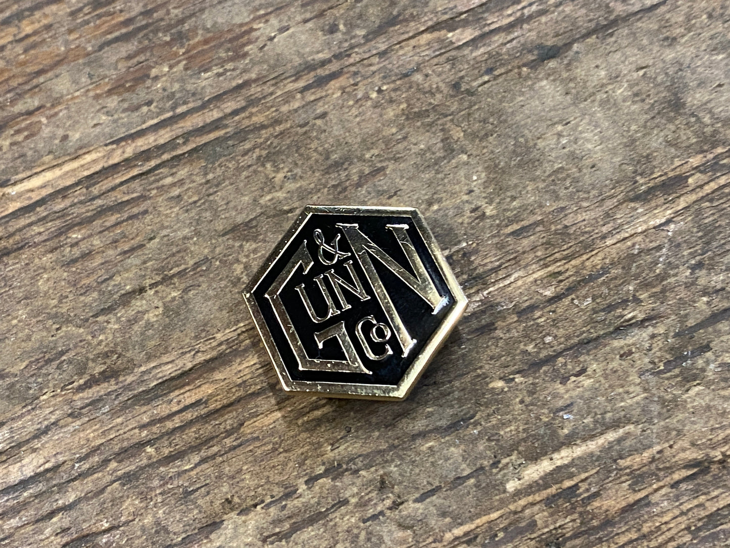 Gunn & Co Gold And Black Enamel Lapel Pin Badge. Badge