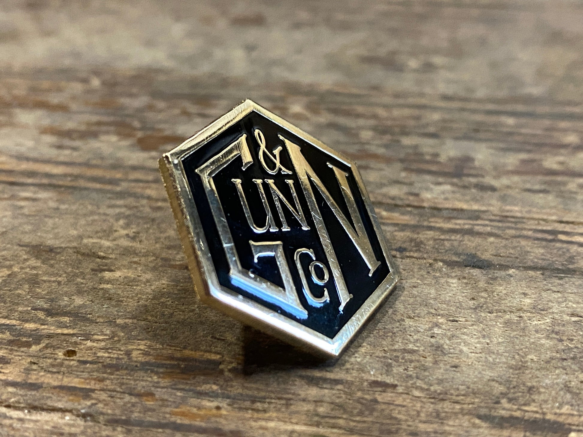 Gunn & Co Gold And Black Enamel Lapel Pin Badge. Badge