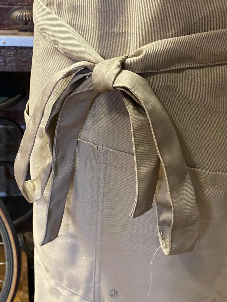 Gunn And Co Workshop Cotton Apron bow fixing