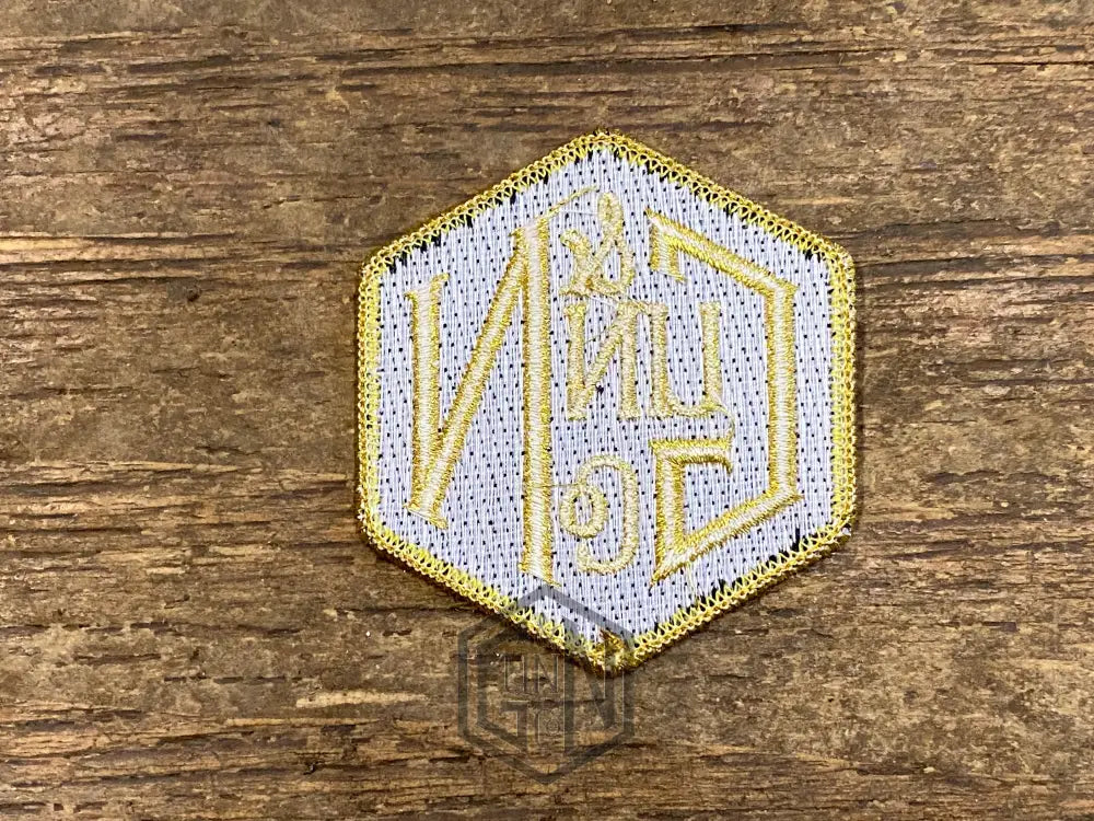 Gunn & Co Gold And Black Embroidered Cloth Badge. Badge